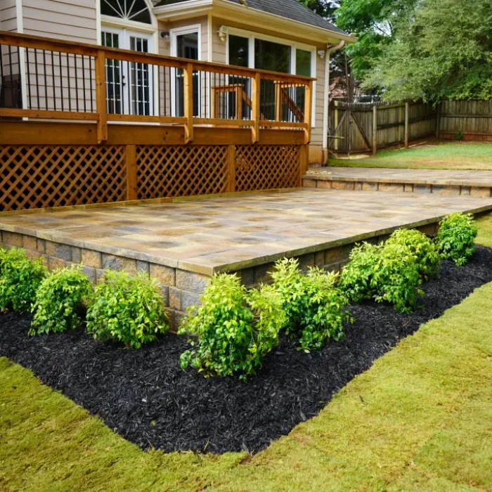 Two tier raised paver patio design and installed by Quiett Scapes