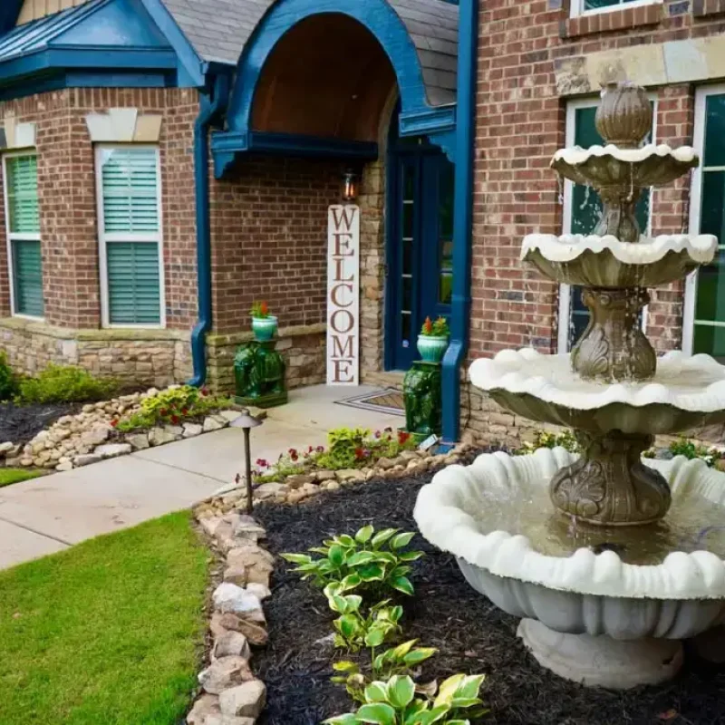 Front yard landscape with water fountain by Quiett Scapes