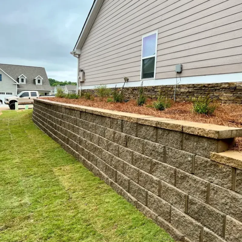 Tan Retaining wall sod and landscape By Quiett Scapes